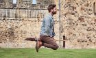 ©VisitBritain - Man hovering on broomstick in the Outer Bailey of Alnwick Castle, Northumberland